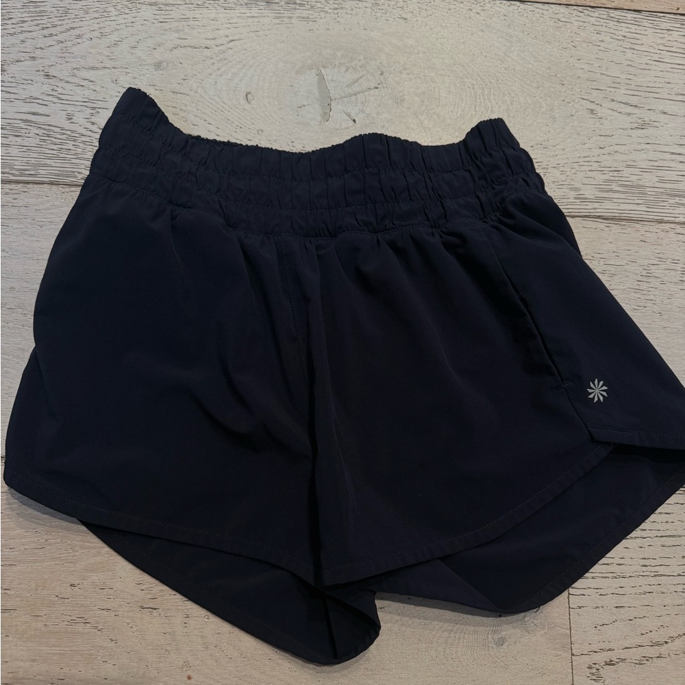 Pristine excellent Athleta Girl Run Free 3 inch Shorts- Navy Size L (12)